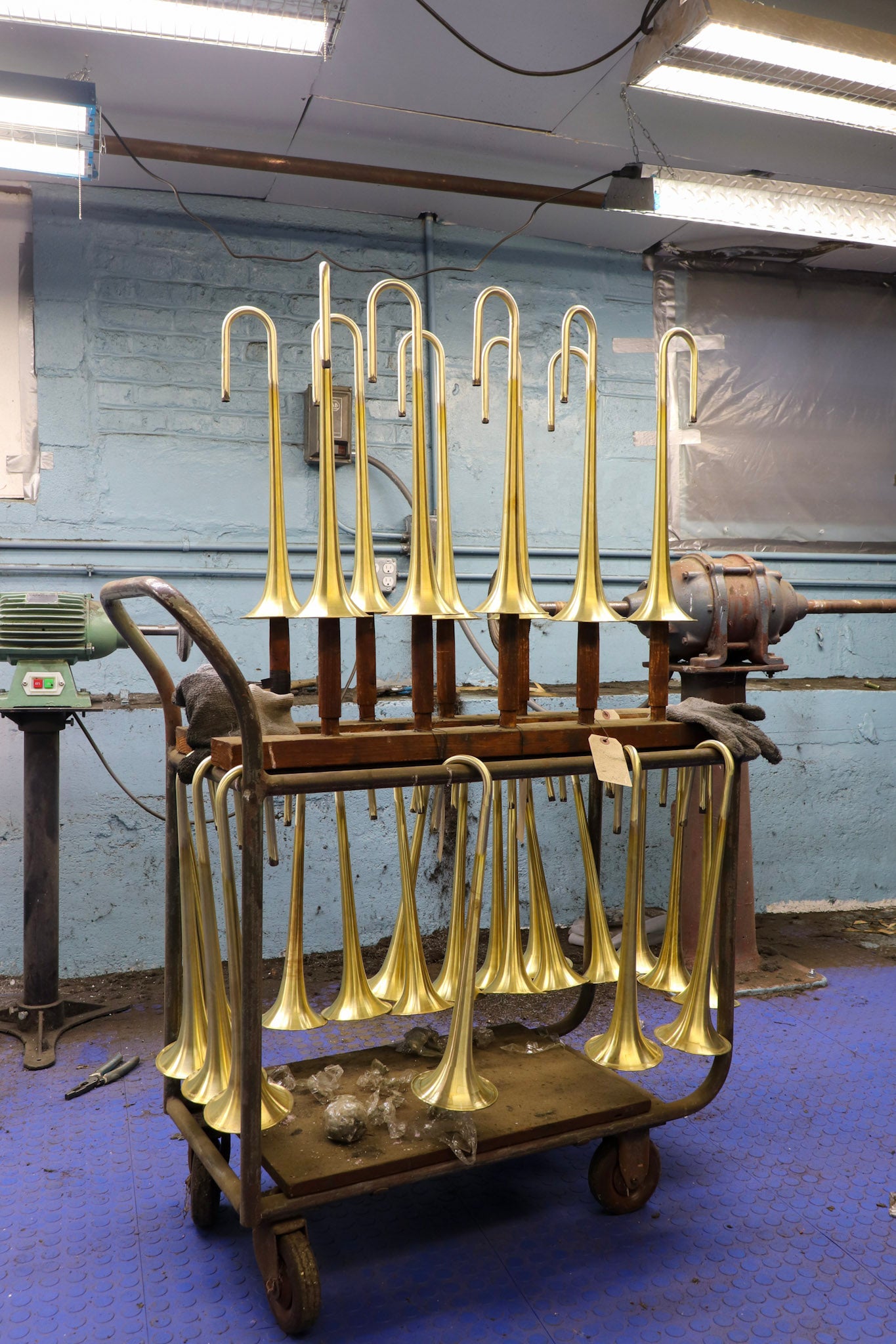 Cart of bent and sanded trumpet bells